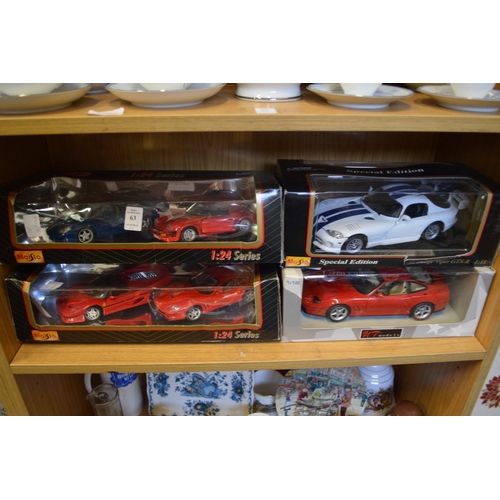 63 - Boxed collectors cars.