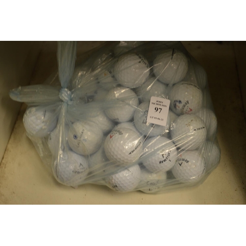 97 - A bag of golf balls.