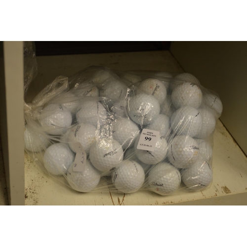 99 - A bag of golf balls.