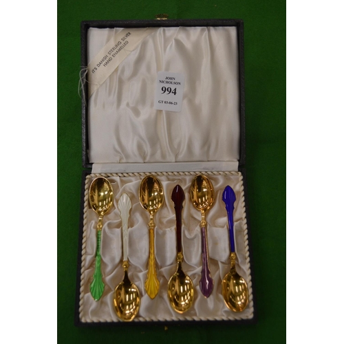 994 - A cased set of six Scandinavian silver gilt and enamel decorated coffee spoons.