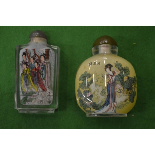 999 - Two modern Chinese reverse painted glass snuff bottles.