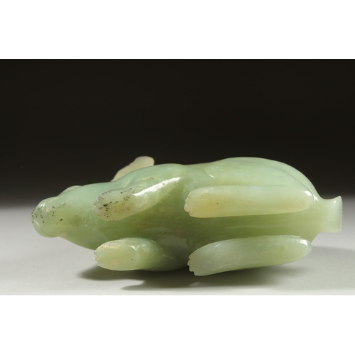 16 - A LARGE CARVED JADE FIGURE OF A RABBIT on a fitted wooden base, 16cm long.