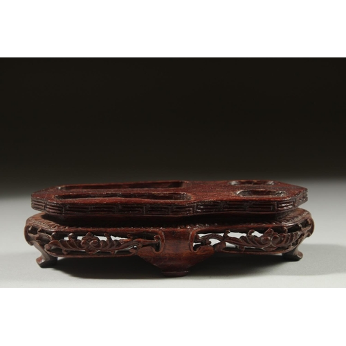 16 - A LARGE CARVED JADE FIGURE OF A RABBIT on a fitted wooden base, 16cm long.