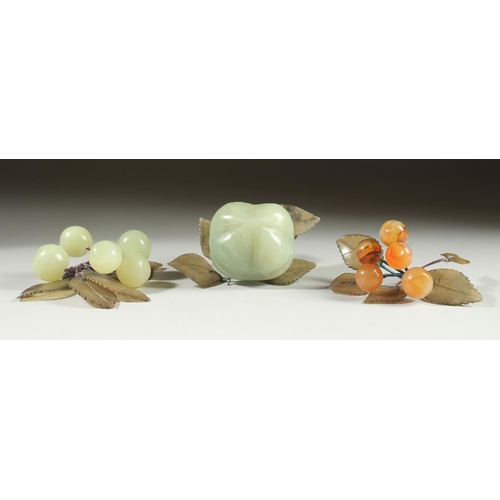 20 - A CARVED JADE BUNCH OF GRAPES, together with another similar hardstone group and a large carved jade... 