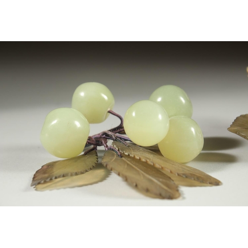 20 - A CARVED JADE BUNCH OF GRAPES, together with another similar hardstone group and a large carved jade... 