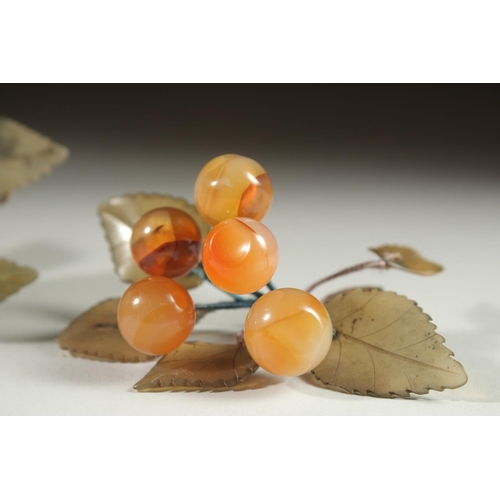 20 - A CARVED JADE BUNCH OF GRAPES, together with another similar hardstone group and a large carved jade... 