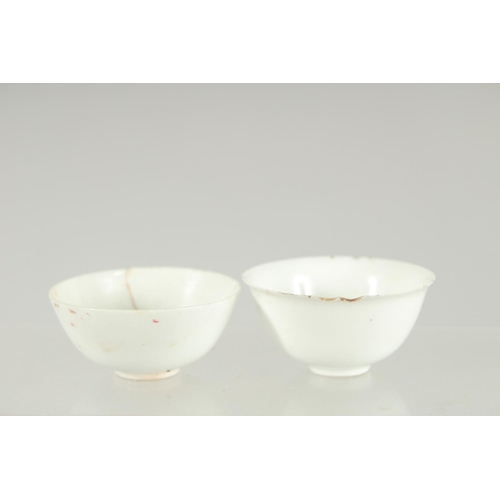 33 - TWO VERY SMALL CHINESE TATHONG CHANNEL SHIPWRECK TEA BOWLS, 1969, (af), 5cm diameter.