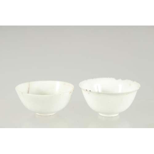 33 - TWO VERY SMALL CHINESE TATHONG CHANNEL SHIPWRECK TEA BOWLS, 1969, (af), 5cm diameter.