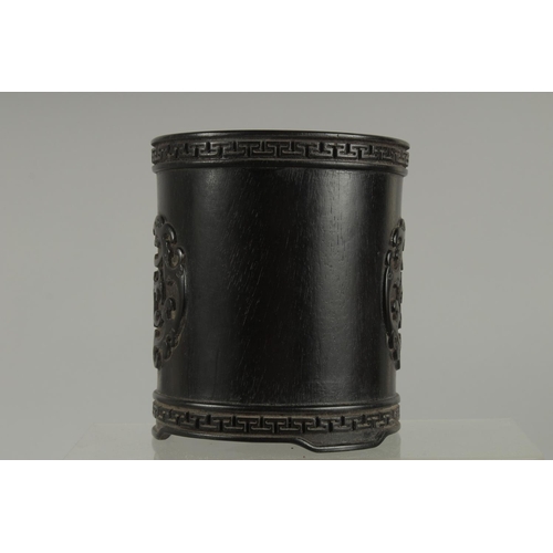 49 - A CHINESE HARDWOOD BRUSH POT; possibly zitan wood, 13cm high.