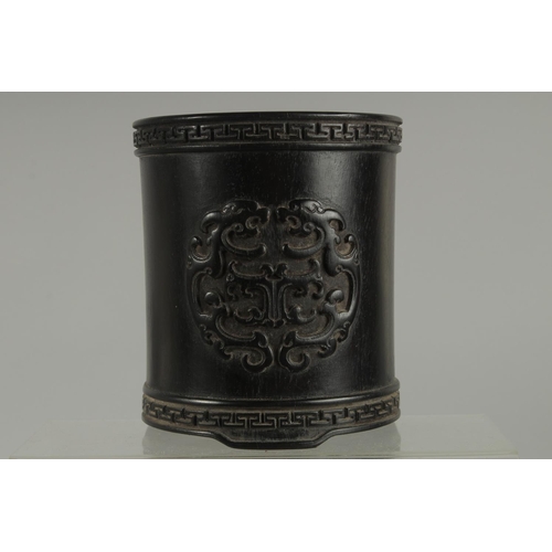 49 - A CHINESE HARDWOOD BRUSH POT; possibly zitan wood, 13cm high.