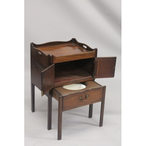 1004 - A GEORGE III MAHOGANY TRAY TOP BEDSIDE TABLE with hand apertures, the front with double panel doors ... 