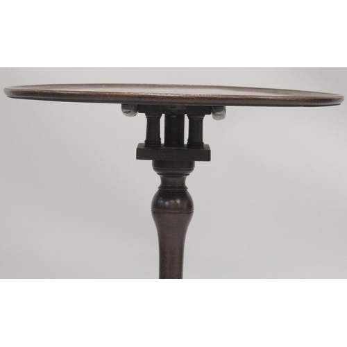 1007 - A GEORGIAN MAHOGANY CIRCULAR TRAY TOP TRIPOD TABLE with birdcage support and three pad feet. 2ft dia... 