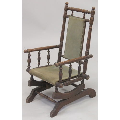 1011 - A SMALL AMERICAN ROCKING CHAIR.