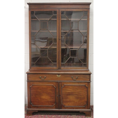 1013 - A LARGE GEORGIAN MAHOGANY STANDING BOOKCASE the top with double panel glazed doors, the base with sl... 