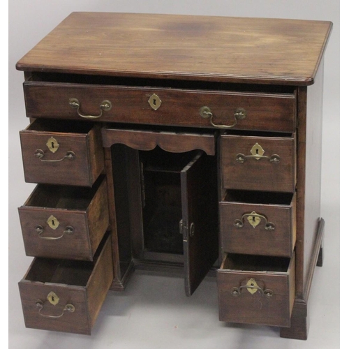 1014 - A GOOD GEORGE III MAHOGANY KNEEHOLE DESK with plain top, three small drawers either side of the knee... 