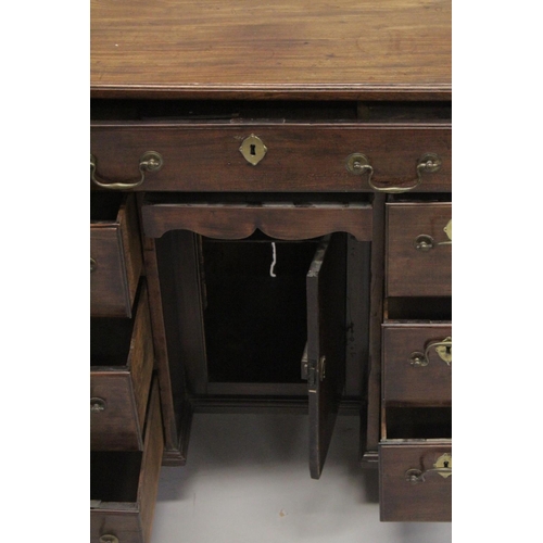 1014 - A GOOD GEORGE III MAHOGANY KNEEHOLE DESK with plain top, three small drawers either side of the knee... 