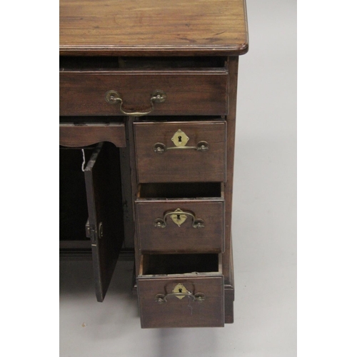 1014 - A GOOD GEORGE III MAHOGANY KNEEHOLE DESK with plain top, three small drawers either side of the knee... 