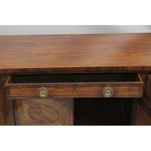 1016 - A GOOD GEORGE III MAHOGANY STRAIGHT FRONTED SIDEBOARD with plain legs and ovals to the front, with c... 