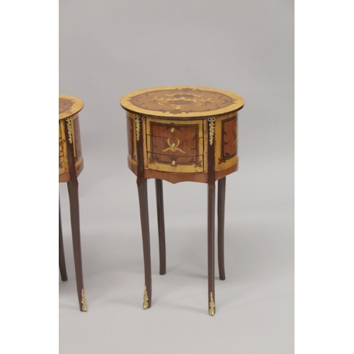 1023 - A PAIR OF LOUIS XVTH DESIGN OVAL BEDSIDE TABLES with three drawers. 2ft 4ins high.