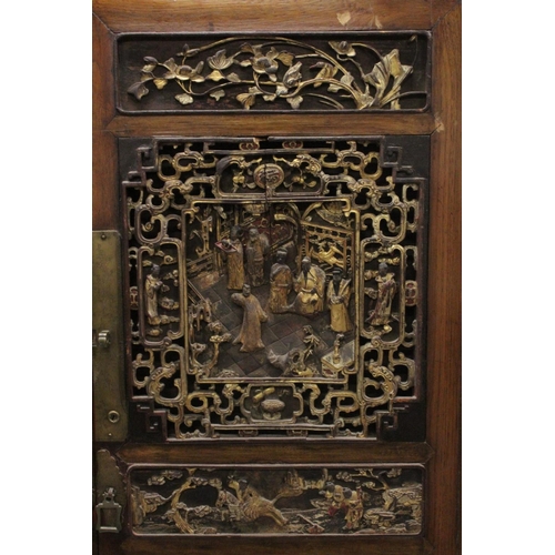 1025 - A 19TH CENTURY CHINESE CABINET with carved and pierced doors. 5ft high, 3ft 4ins wide.