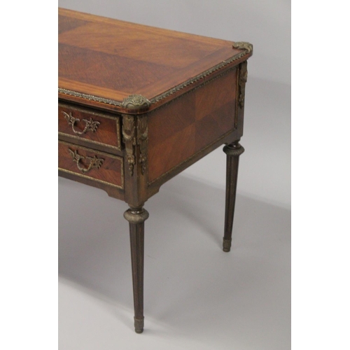 1027 - A LOUIS XVITH DESIGN WRITING TABLE with wooden top, five drawers on turned legs with ormolu mounts. ... 