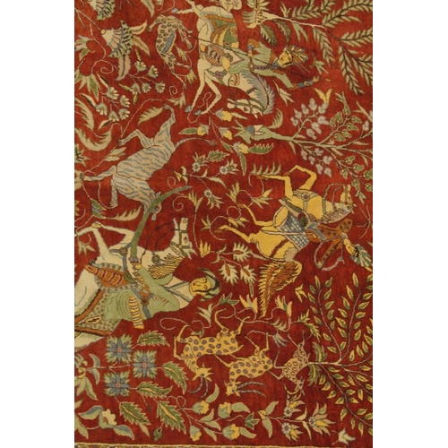 1039 - A VERY GOOD PERSIAN SILK HUNTING RUG red ground with figures of huntsmen on horseback, animals and t... 