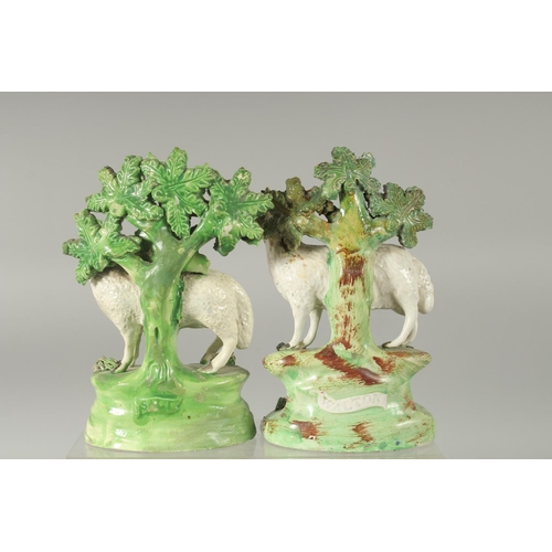 1061 - A PAIR OF STAFFORDSHIRE BOCAGE GROUP OF SHEEP AND LAMBS with Bocage backs. 6ins high.