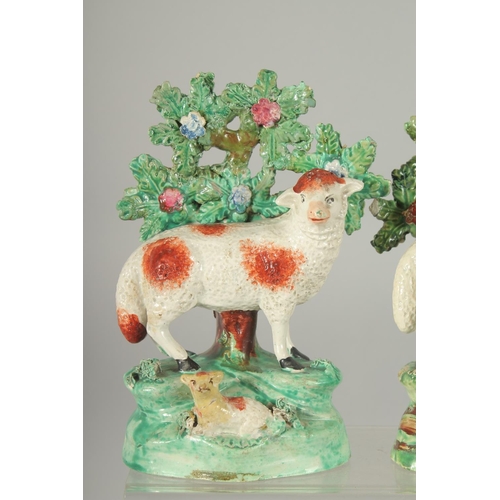 1064 - A PAIR OF STAFFORDSHIRE BOCAGE GROUP OF SHEEP with lambs, with bocage backs.