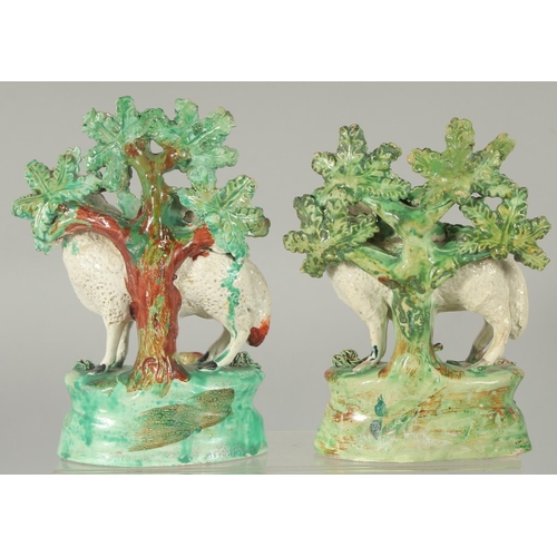 1064 - A PAIR OF STAFFORDSHIRE BOCAGE GROUP OF SHEEP with lambs, with bocage backs.