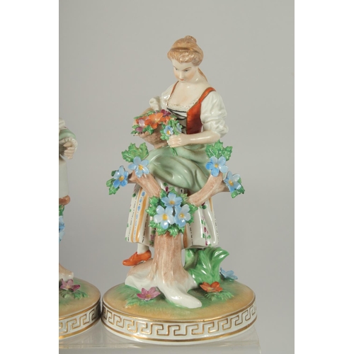 1071 - A PAIR OF SITZENDORF PORCELAIN FIGURES of a man with a watering can and a young lady with a basket o... 