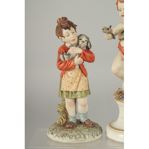 1073 - TWO CAPODIMONTE PORCELAIN FIGURES a cupid and A YOUNG MAN with a dog. 8ins and 7ins high (2).