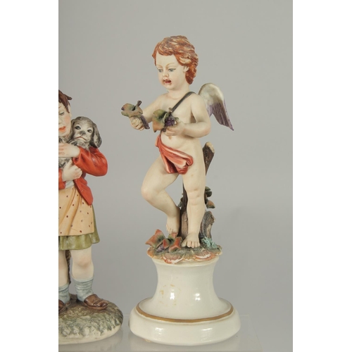 1073 - TWO CAPODIMONTE PORCELAIN FIGURES a cupid and A YOUNG MAN with a dog. 8ins and 7ins high (2).