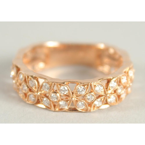 1658 - AN 18 CARAT ROSE GOLD AND DIAMOND THREE QUARTERS BANDED RING. Diamond 0.6 carat.