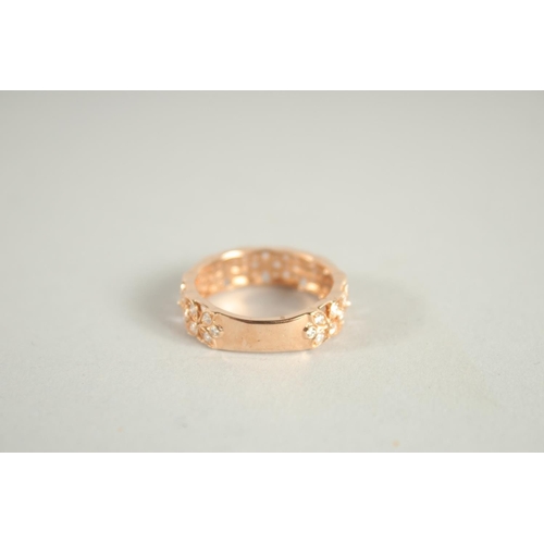 1658 - AN 18 CARAT ROSE GOLD AND DIAMOND THREE QUARTERS BANDED RING. Diamond 0.6 carat.