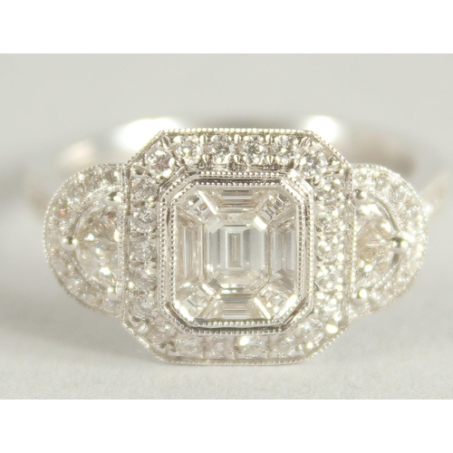 1660 - AN 18 CARAT WHITE GOLD AND DIAMOND RING. (Total diamond weight approx. 1.2 carat)