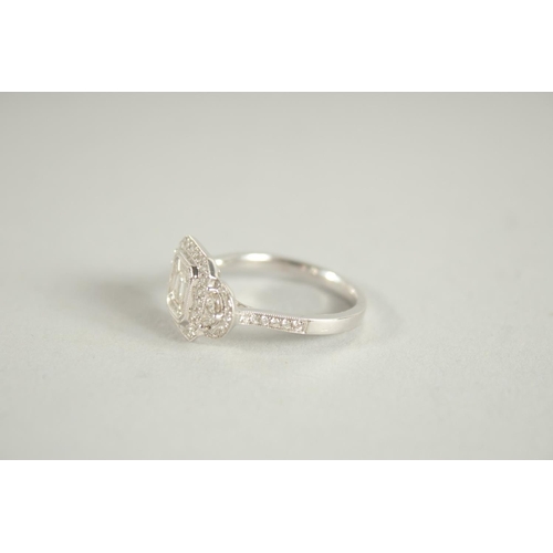 1660 - AN 18 CARAT WHITE GOLD AND DIAMOND RING. (Total diamond weight approx. 1.2 carat)