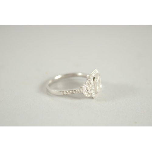 1660 - AN 18 CARAT WHITE GOLD AND DIAMOND RING. (Total diamond weight approx. 1.2 carat)