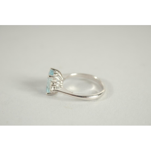 1661 - AN 18 CARAT WHITE GOLD HALLMARKED OCTAGONAL AQUAMARINE AND DIAMOND RING.