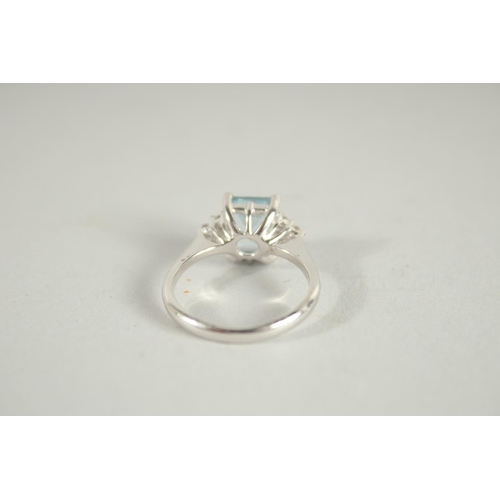 1661 - AN 18 CARAT WHITE GOLD HALLMARKED OCTAGONAL AQUAMARINE AND DIAMOND RING.