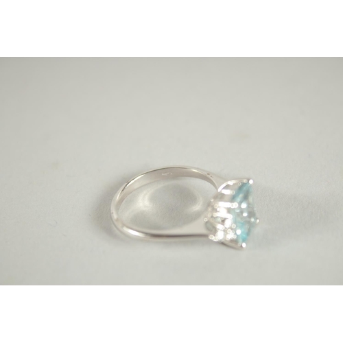 1661 - AN 18 CARAT WHITE GOLD HALLMARKED OCTAGONAL AQUAMARINE AND DIAMOND RING.