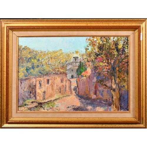 41 - Continental School, Circa 1989, a village street view, oil on canvas, indistinctly signed, 13