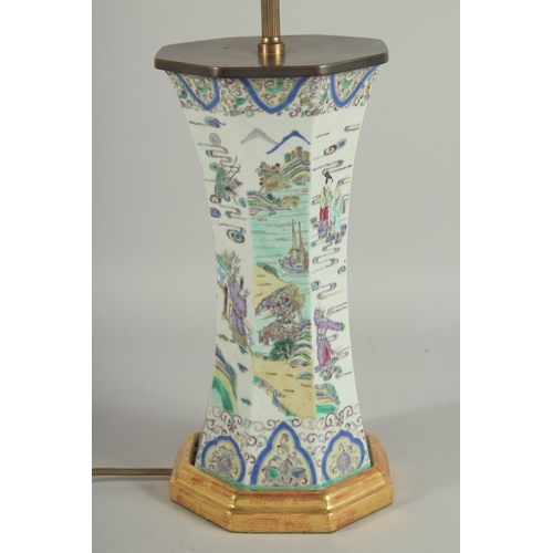 1 - A 19TH CENTURY FAMILLE VERTE PORCELAIN OCTAGONAL VASE, converted to a lamp, painted with various fig... 