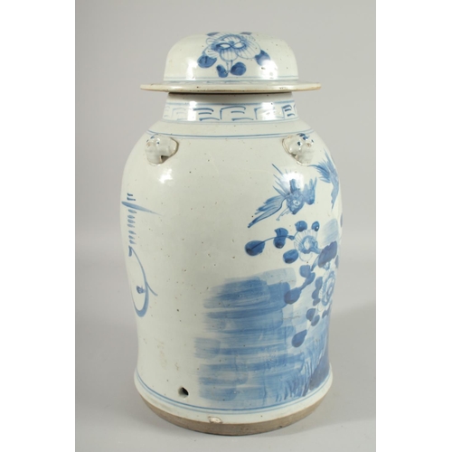 100 - A LARGE CHINESE BLUE AND WHITE PORCELAIN LAMP STAND JAR AND COVER, painted with birds and native flo... 