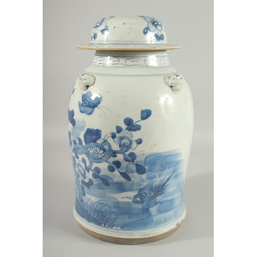 100 - A LARGE CHINESE BLUE AND WHITE PORCELAIN LAMP STAND JAR AND COVER, painted with birds and native flo... 