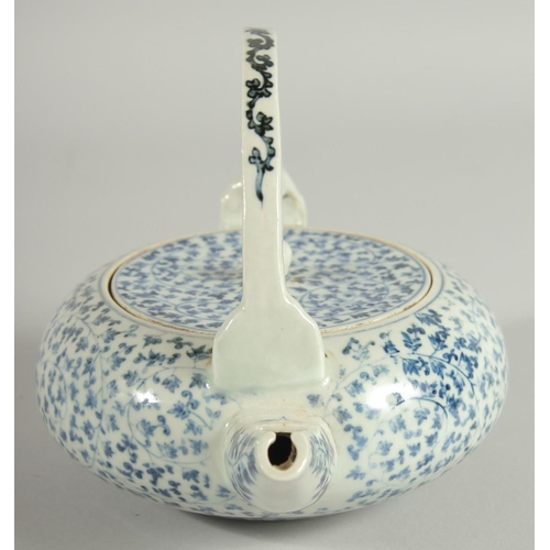 106 - A JAPANESE BLUE AND WHITE PORCELAIN TEAPOT, with foliate decoration.