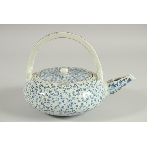 106 - A JAPANESE BLUE AND WHITE PORCELAIN TEAPOT, with foliate decoration.