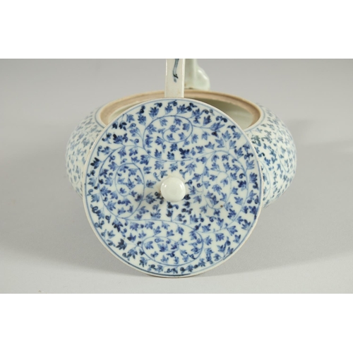 106 - A JAPANESE BLUE AND WHITE PORCELAIN TEAPOT, with foliate decoration.