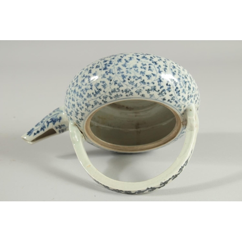 106 - A JAPANESE BLUE AND WHITE PORCELAIN TEAPOT, with foliate decoration.