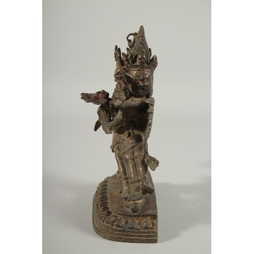 107 - A TIBETAN BRONZE FIGURE OF A THREE-HEADED DEITY, 24.5cm high.