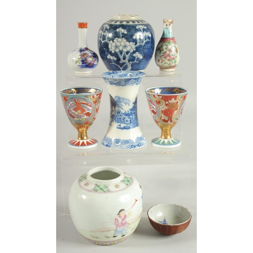 11 - A GROUP OF MIXED ORIENTAL PORCELAIN ITEMS, including a famille rose jar, a blue and white prunus jar... 